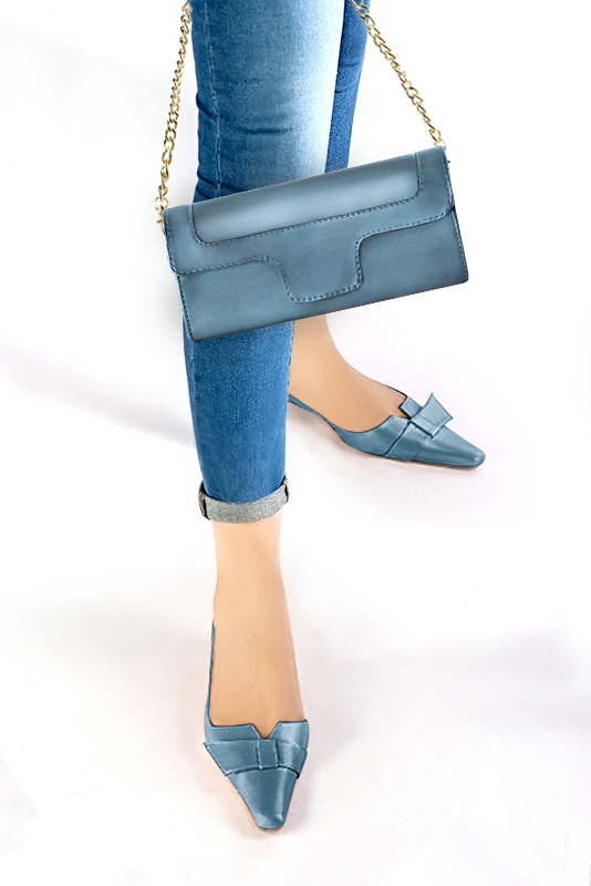 Women's peacock blue luxurious elegant clutch for ceremonies, weddings and evenings out. - Worn view
